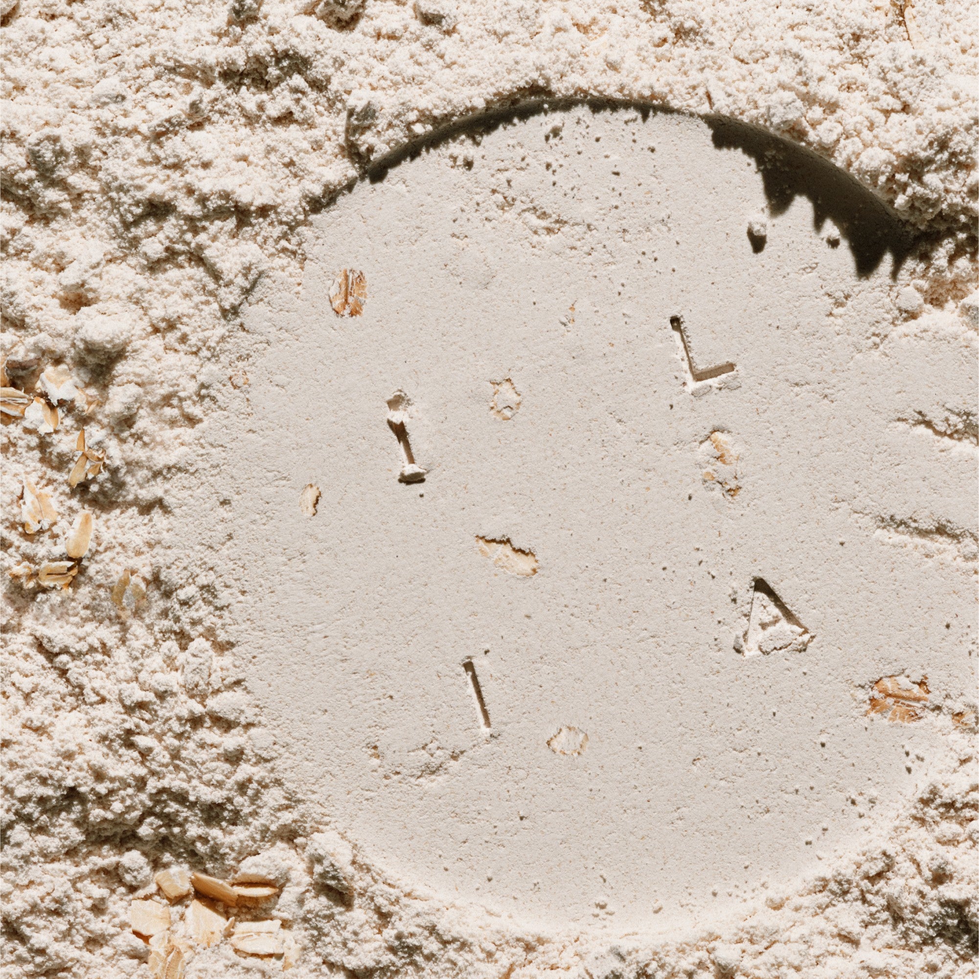 The word ILIA stamped into the Colloidal oat ingredient in Barrier Build.