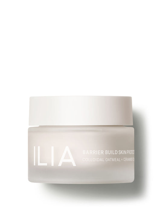 ILIA Barrier Build Skin Protectant Cream jar featuring a minimalist white design with colloidal oatmeal and ceramides.