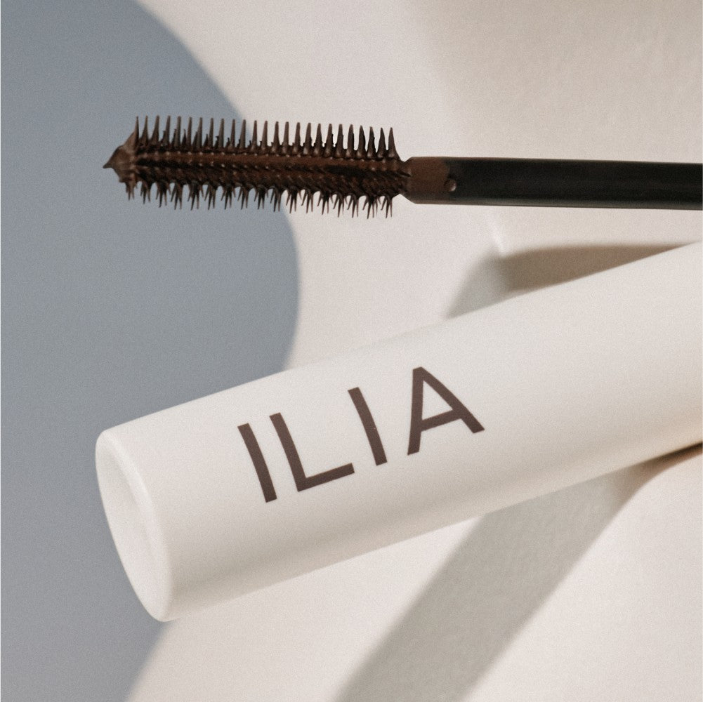 A close up of ILIA mascara applicator.