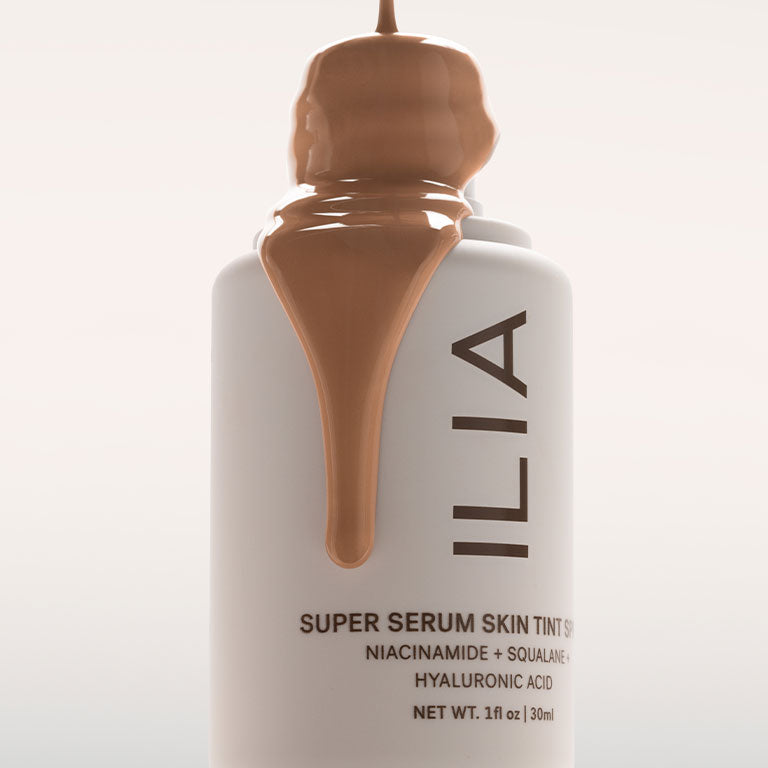 Bottle of Super Serum Skin Tint with product texture
